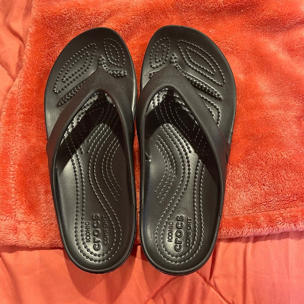 Crocs flip flops.